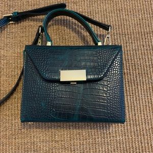 Emerald green crocodile embossed leather handbag